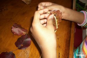 Threading a Fall Leaf Garland